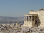 The Erechteion temple, with the Caryatids and Athens on the background. The only finished building on the whole Acropolis