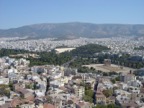 View of central Athens from the Acropolis. On the right is the temple of Zeus and the Panatinaikos stadium is in the middle. The first modern Olympic Games were held here.