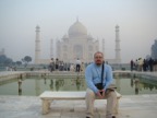 A tourist on a bench wondering where the Taj Mahal is