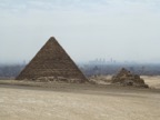 Pyramid of Menkaure, the smallest of the three. The 3 small pyramids on the right were for queens